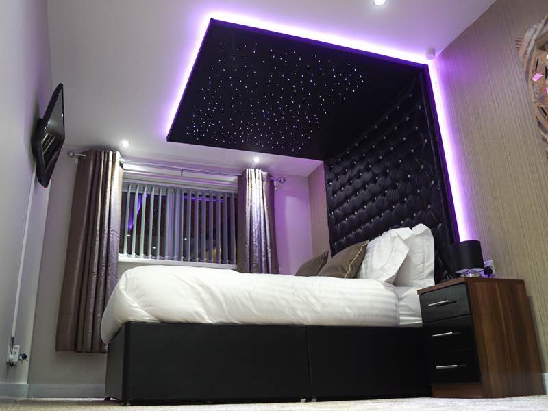 Bespoke fibre-optic star ceiling with colour-changing LED mood lighting in a Birmingham bedroom